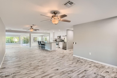 You will walk into a gorgeous 3 bedroom home remodeled in 2021 on Union Hills Country Club in Arizona - for sale on GolfHomes.com, golf home, golf lot