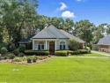 Located on the 2nd hole in Rock Creek, this beautiful home has a for sale in Fairhope Alabama Baldwin County County on GolfHomes.com
