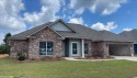 Move-in this summer! This beautiful 4-bedroom, 3 bath brick home for sale in Foley Alabama Baldwin County County on GolfHomes.com
