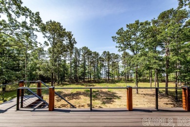Situated on the shores Greers Ferry Lake, this home showcases on Indian Hills Country Club in Arkansas - for sale on GolfHomes.com, golf home, golf lot